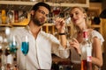 Smart nice people looking at the glass of wine Royalty Free Stock Photo