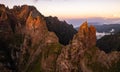 Huge rocky mountains under cloudy sunset sky Royalty Free Stock Photo