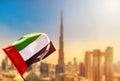 Amazing Dubai skyline cityscape with modern skyscrapers and UAE flag. Downtown of Dubai at sunny day, United Arab Emirates Royalty Free Stock Photo