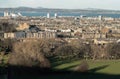 Amazing Edinburgh Cityscape with Holyrood Park and Leith docks seen from the top of Salisbury Crags