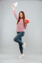 Amazing emotional young asian lady holding gift and money. Royalty Free Stock Photo