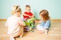 Amazing busy cube and three kids playing with it