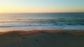 Amazing evening sky ocean drone view. Foamy sea waves washing sandy beach. Royalty Free Stock Photo