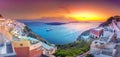 Amazing evening view of Fira, caldera, volcano of Santorini, Greece with cruise ships at sunset. Cloudy dramatic sky Royalty Free Stock Photo