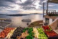 Amazing evening view of Fira, caldera, volcano of Santorini, Greece with cruise ships at sunset. Royalty Free Stock Photo