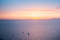 Amazing evening view of Fira, caldera, volcano of Santorini, Greece with cruise ships at sunset. Cloudy dramatic sky Royalty Free Stock Photo