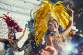 The amazing feeling of dancing the night away. beautiful samba dancers performing in a carnival with their band.