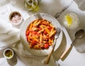 Amazing fine dining italian pasta penne arrabbiata, cherry tomato, sauce, Parmesan, thyme, garlic, olive oil, in a plate. Italian