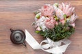 Amazing flower bouquet with ceramics tea pot on wood Royalty Free Stock Photo