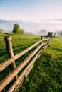 Amazing foggy morning in the rural area of Bucovina, Romania. Royalty Free Stock Photo