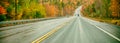 Amazing foliage colors. New England road through the forest in autumn season