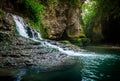 Amazing forest waterfall flowing into the cold mountain river. Martvili canyon. Nature fall