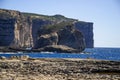 Amazing Fungus and Gebla Rock cliffs in the Dwejra Bay beach near collapsed Azure window, Gozo island, Malta Royalty Free Stock Photo