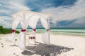 Amazing gorgeous inviting view of wedding decorated gazebo standing on tropical beach