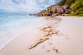 Amazing Granite rocks, white sand and blue clear ocean at Grand Anse, La Digue island, Seychelles. Nature background Royalty Free Stock Photo