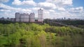 Amazing high angle top drone view on Strogino and Shchukinodistrict which are situated in beautiful green river park.