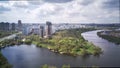 Amazing high angle top drone view on Strogino and Shchukinodistrict which are situated in beautiful green river park.