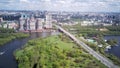 Amazing high angle top drone view on Strogino and Shchukinodistrict which are situated in beautiful green river park.