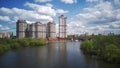 Amazing high angle top drone view on Strogino and Shchukinodistrict which are situated in beautiful green river park.