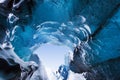 Amazing ice cave. Blue crystal ice cave and an underground river beneath the glacier. Amazing nature of Skaftafell. Royalty Free Stock Photo