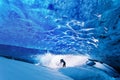 Amazing ice cave. Blue crystal ice cave and an underground river beneath the glacier. Amazing nature of Skaftafell. Royalty Free Stock Photo