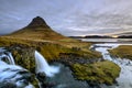 Amazing Icelandic landscape at the top of Kirkjufellsfoss waterfall with Kirkjufell mountain in the background