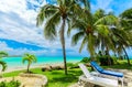 Amazing inviting Varadero Cuban beach and tranquil turquoise ocean, view from tropical palm trees garden