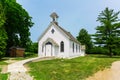 Amazing inviting view on old white church in outdoor park