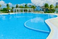 Amazing inviting view of swimming pool with tranquil turquoise clear water, sunny summer gorgeous day