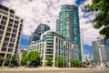 Amazing, inviting view of Toronto down town area with modern stylish residential condo buildings, cars and people walking in backg Royalty Free Stock Photo