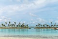 Amazing island in the Maldives , Beautiful turquoise waters and white sandy beach with blue sky background for holiday vacation Royalty Free Stock Photo