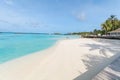 Amazing island in the Maldives Beautiful turquoise waters and white sandy beach with blue sky background for holiday vacation Royalty Free Stock Photo