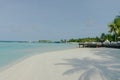 Amazing island in the Maldives , Beautiful turquoise waters and white sandy beach with blue sky background for holiday vacation Royalty Free Stock Photo