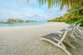 Amazing island in the Maldives , Beautiful turquoise waters and white sandy beach with blue sky background for holiday vacation Royalty Free Stock Photo