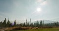 Nice Ladscape with Mountains, Forest and Clouds driven by Wind