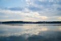 Amazing lake landscape in the evening. Blue yellow cloudy sky with reflection in water at sunset. Nature protection concept. Rural Royalty Free Stock Photo