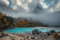 Amazing lake Sorapis and misty mountains at autumn, Dolomites, Italy Royalty Free Stock Photo