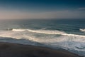 Amazing landscape on the Atlantic ocean at morning. View of the the foam waves of the ocean and sandy beach. Beach of Praia das Ma Royalty Free Stock Photo