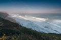 Amazing landscape on the Atlantic ocean at morning. View of the steep slopes of the rocky coast and the foam waves of the ocean. B Royalty Free Stock Photo