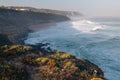 Amazing landscape on the Atlantic ocean at morning. View of the steep slopes of the rocky coast and the foam waves of the ocean. B