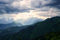 Amazing landscape with dramatic storm clouds over a mountain range and stunning Triglav mount on background, Karavanke, Slovenia Royalty Free Stock Photo