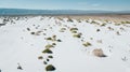 Amazing landscape with gypsum dunes in the middle of the desert with shades in the white and green sand of the little vegetation Royalty Free Stock Photo