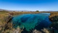 Amazing landscape with a lake and river in the middle of the desert with shades in the water of blue and turquoise green Royalty Free Stock Photo