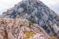 Amazing landscape with a mountain range and a tourist with a backpack in the foreground. mountaineering and climbing