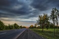 Amazing landscape of road among stone autumn mountains with bright blue soft cloudy blue sky or mountains stretching into the brig Royalty Free Stock Photo