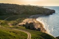 Amazing landscape with sea bay, sand beach and coastal hills and rocks on summer evening at sunset. Trip to seaside. General`s Royalty Free Stock Photo