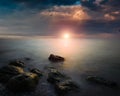 Amazing landscape of sea at sunset. Colorful evening view of the dramatic sky,  waves and rocky sea beach. Long exposure image. Co Royalty Free Stock Photo