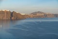 Amazing landscape seen from Oia village of Santorini's cliffs and coastline at sunset, Greece. Royalty Free Stock Photo