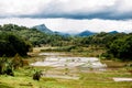 Amazing landscape of South Sualwesi, Rantepao, Tana Toraja, Indonesia. Rice fields with water, mountains, cloudy sky.