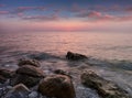 Amazing landscape of sunrise at sea. Colorful morning view of dramatic sky, seascape and rock. Greece.